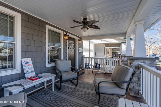 wooden deck with ceiling fan and covered porch