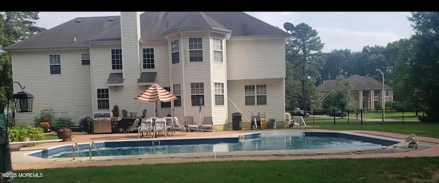 rear view of property featuring a patio