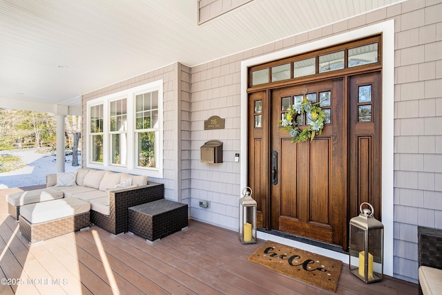 doorway to property featuring a porch