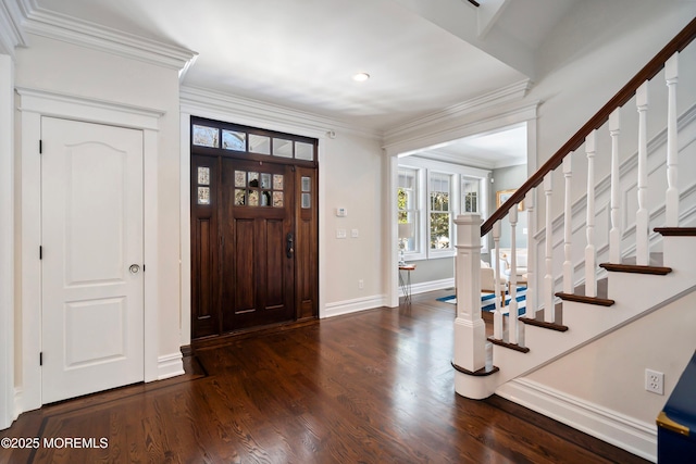 entryway with crown molding and dark hardwood / wood-style floors