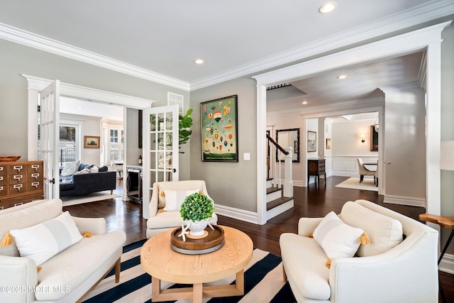 living room with crown molding and dark hardwood / wood-style flooring