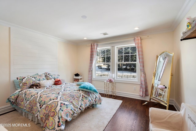 bedroom with a baseboard radiator, ornamental molding, and dark hardwood / wood-style floors