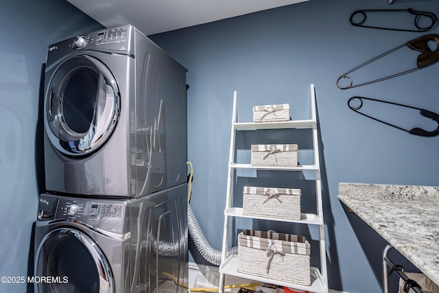 washroom with stacked washer / dryer