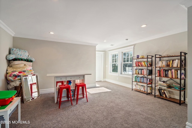 rec room featuring crown molding and carpet flooring