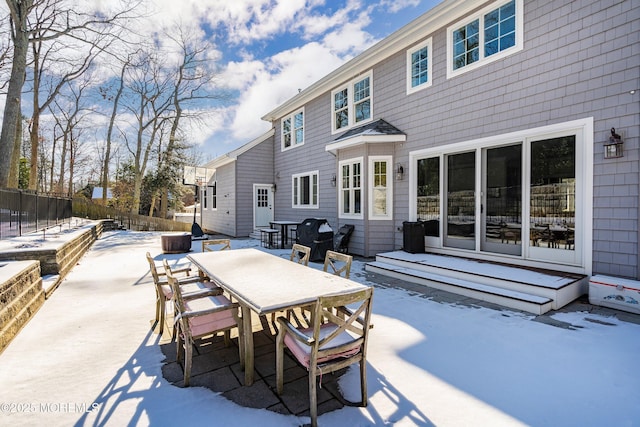 view of snow covered patio