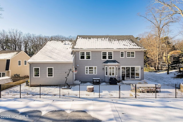 view of snow covered house