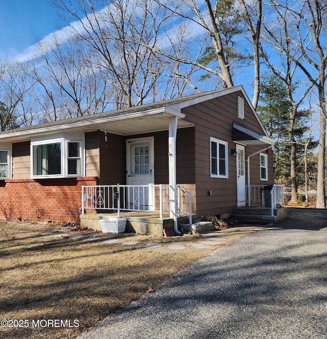 view of front of house with brick siding