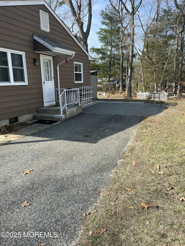 exterior space with crawl space