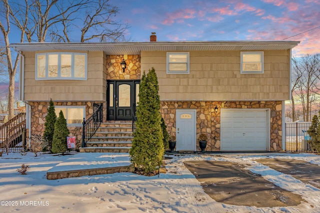 bi-level home featuring a garage