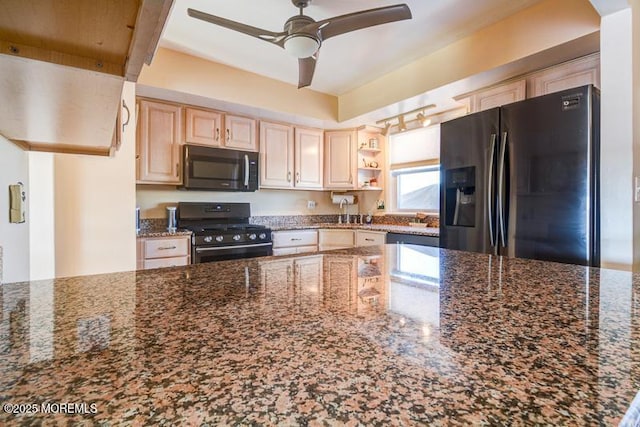 kitchen with light brown cabinetry, range, dark stone countertops, refrigerator with ice dispenser, and ceiling fan