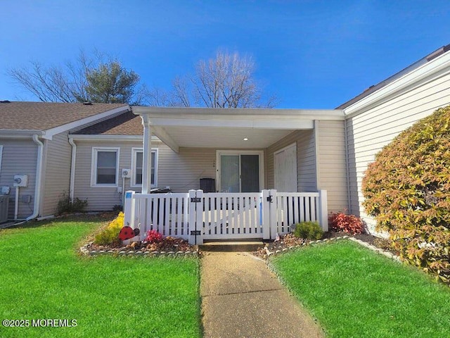19B Plaza Del Campillo Unit 1000, Freehold, NJ 07728 - doorway to property featuring a porch and a lawn