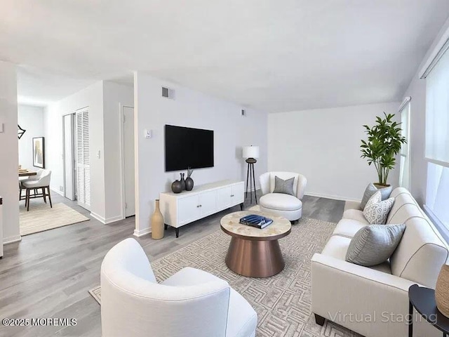 19B Plaza Del Campillo Unit 1000, Freehold, NJ 07728 - living room with wood finished floors and baseboards