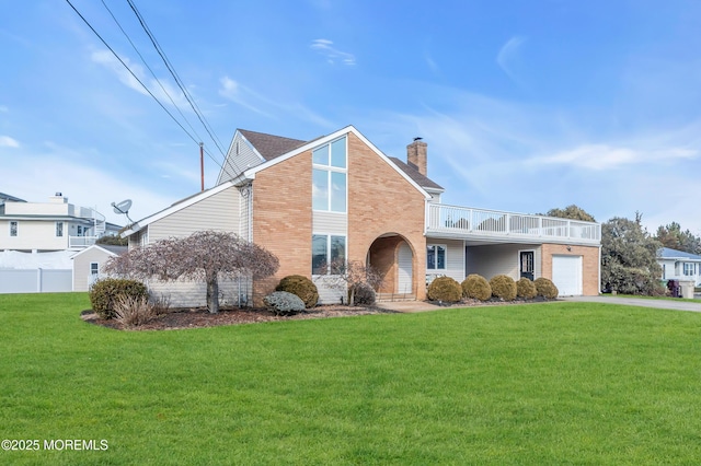 front facade with a garage and a front yard