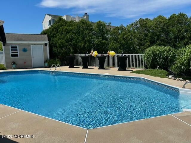 view of pool featuring an outdoor structure