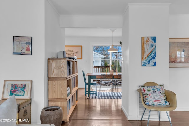 hallway featuring crown molding and dark hardwood / wood-style floors