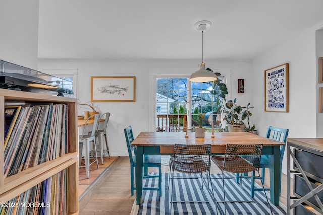 dining space with light hardwood / wood-style flooring