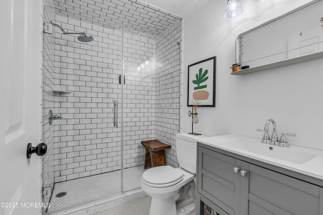 bathroom with vanity, toilet, and a shower with shower door