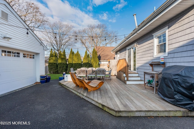 wooden deck featuring grilling area