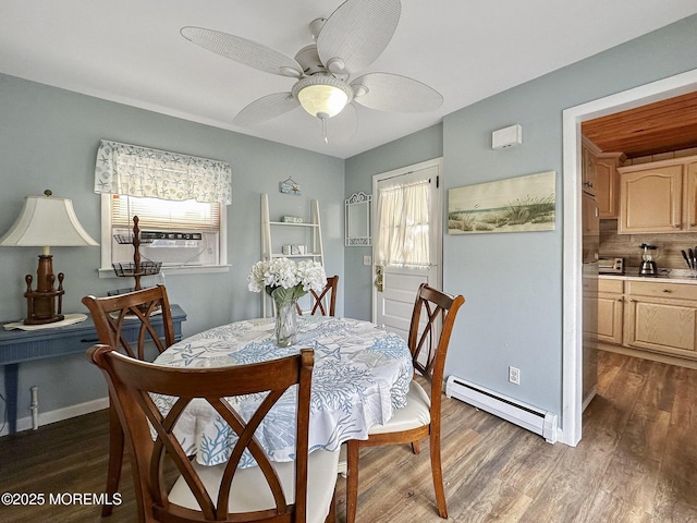 dining space with a baseboard radiator, cooling unit, ceiling fan, and dark hardwood / wood-style flooring