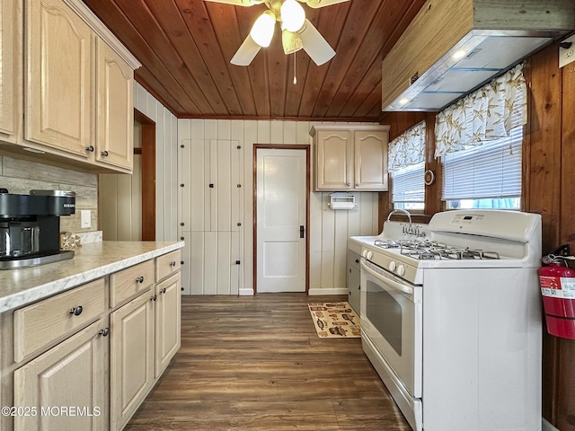 kitchen featuring wood ceiling, dark hardwood / wood-style flooring, white range with gas stovetop, and wood walls