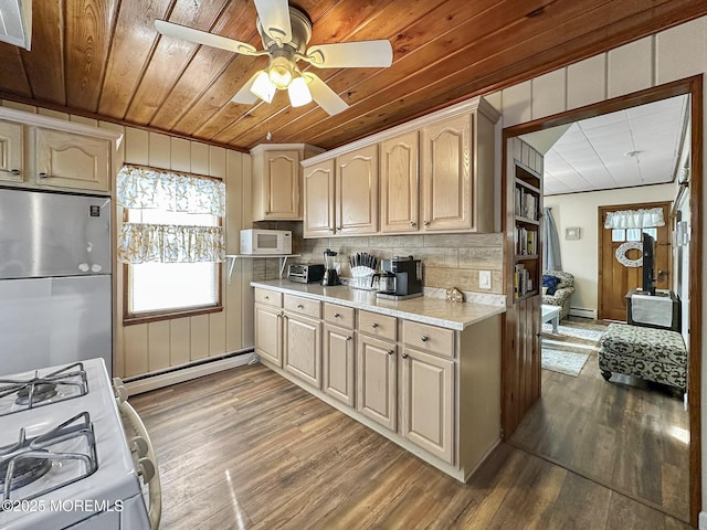 kitchen with dark hardwood / wood-style floors, white appliances, a baseboard radiator, and wooden ceiling