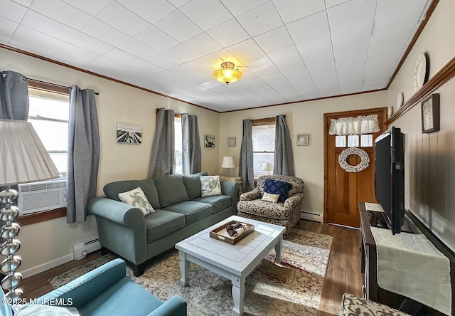 living room with hardwood / wood-style flooring, a baseboard heating unit, a wealth of natural light, and cooling unit