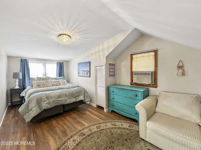 bedroom featuring cooling unit, dark hardwood / wood-style flooring, and lofted ceiling