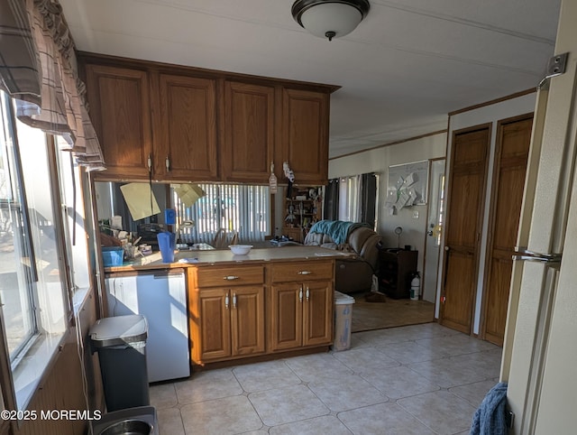 kitchen with crown molding, fridge, and white refrigerator