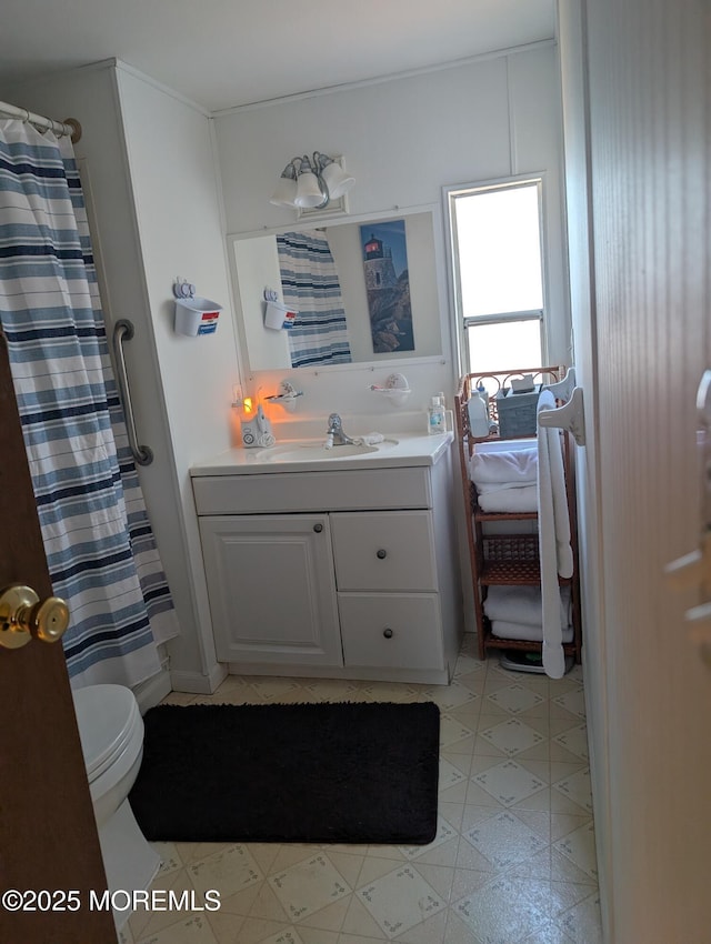 bathroom with vanity and toilet