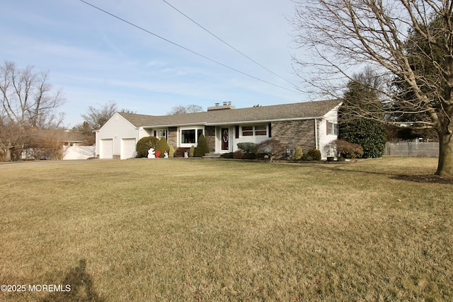 single story home featuring a garage and a front lawn