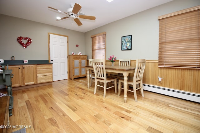 dining room featuring ceiling fan and light wood-type flooring