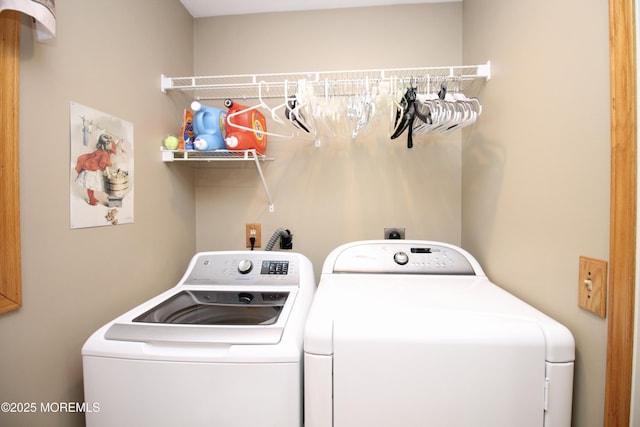 clothes washing area featuring washing machine and clothes dryer