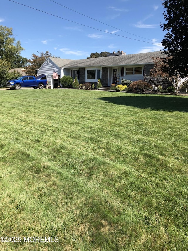 single story home featuring a front lawn