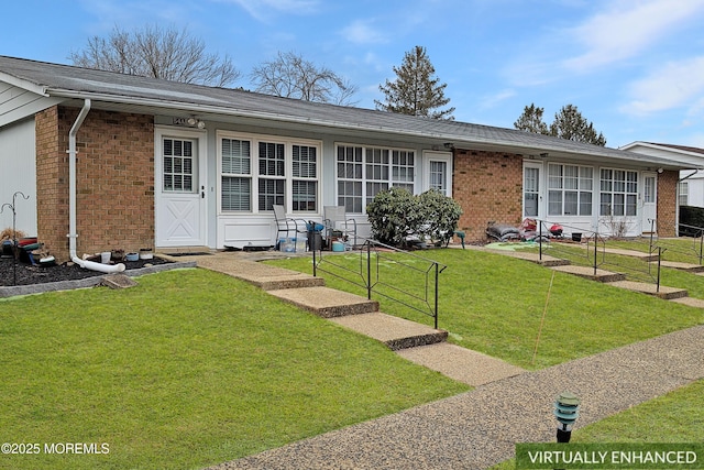 single story home with a front lawn