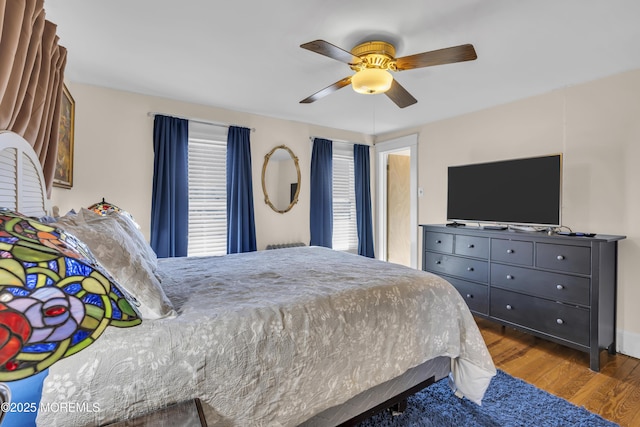 bedroom featuring wood-type flooring and ceiling fan