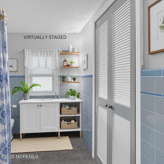 bar with tile walls and white cabinets