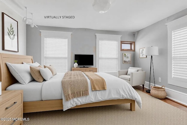 bedroom featuring wood-type flooring