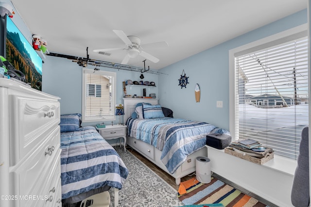 bedroom featuring dark wood-type flooring and ceiling fan