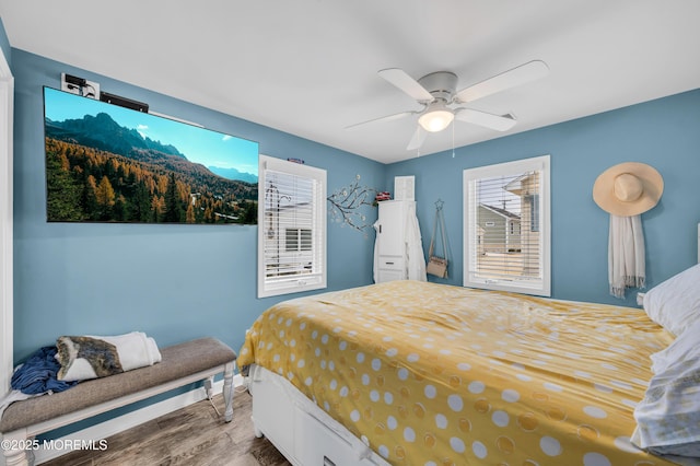 bedroom featuring hardwood / wood-style floors and ceiling fan