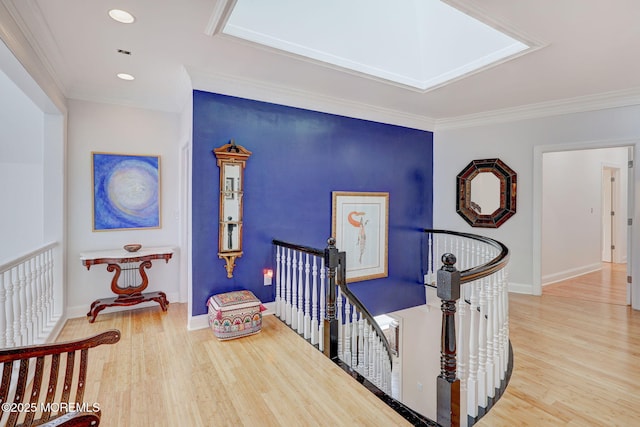 corridor featuring ornamental molding and wood-type flooring