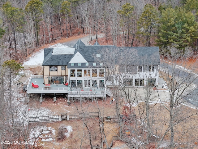 rear view of property with a wooden deck