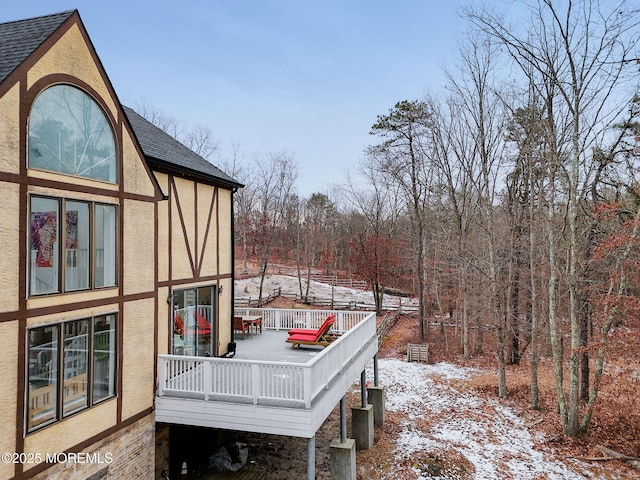 view of snow covered deck