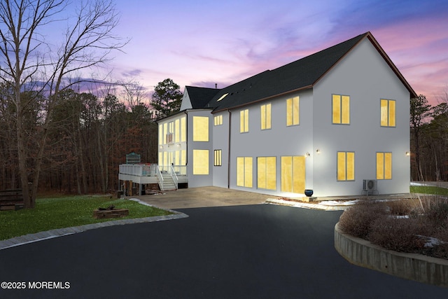 view of back house at dusk