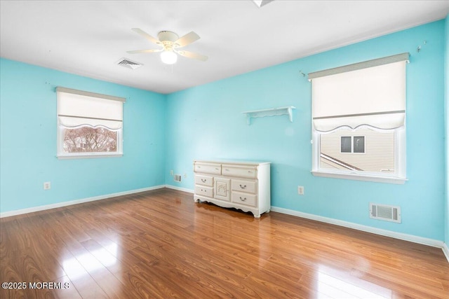 unfurnished bedroom featuring hardwood / wood-style floors and ceiling fan