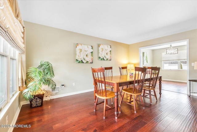 dining room featuring a chandelier and dark hardwood / wood-style flooring