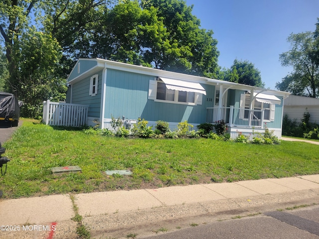131 Douglas Dr, Jackson, NJ 08527 - view of front facade featuring covered porch and a front lawn