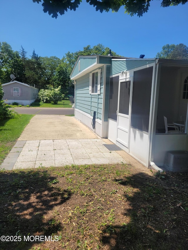 131 Douglas Dr, Jackson, NJ 08527 - rear view of house featuring a sunroom