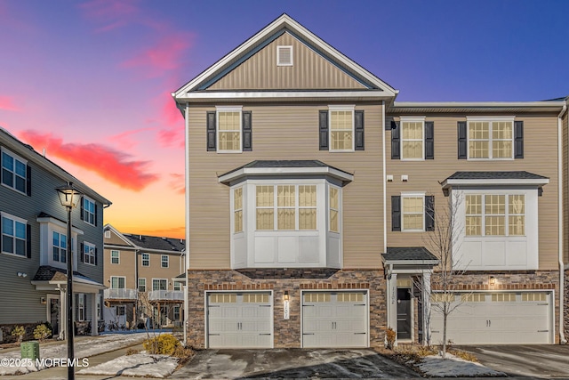 townhome / multi-family property featuring a garage