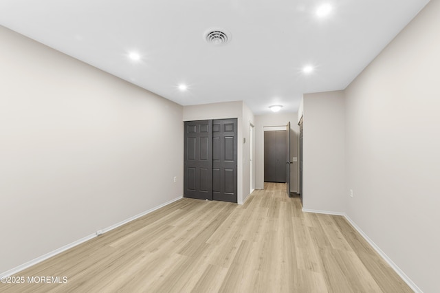 unfurnished bedroom featuring light wood-type flooring