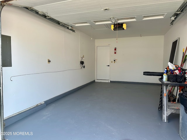 garage featuring a garage door opener and electric panel